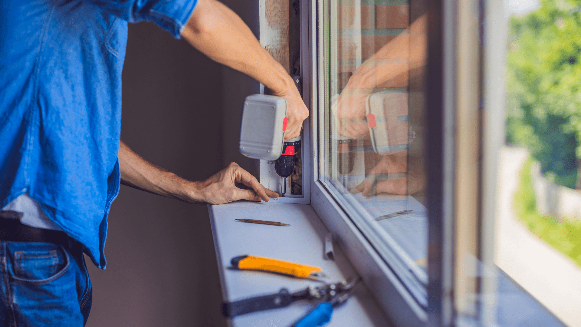 Man installing window