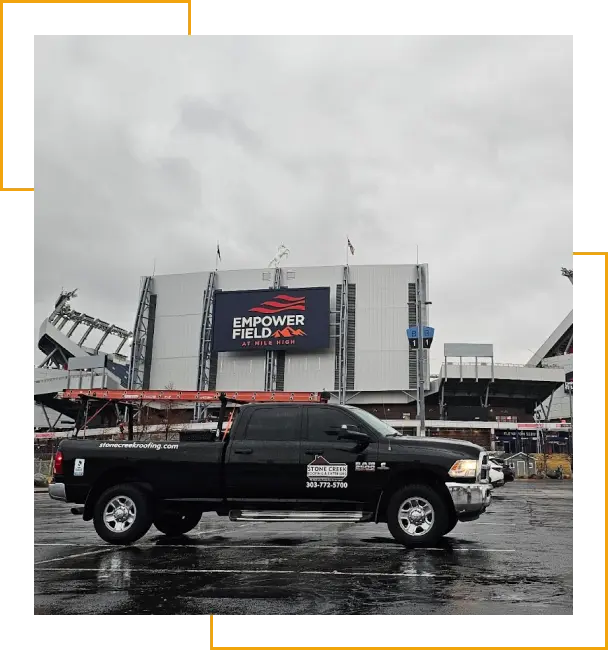 Stone Creek Roofing truck in front of Mile High Stadium in Denver, CO.